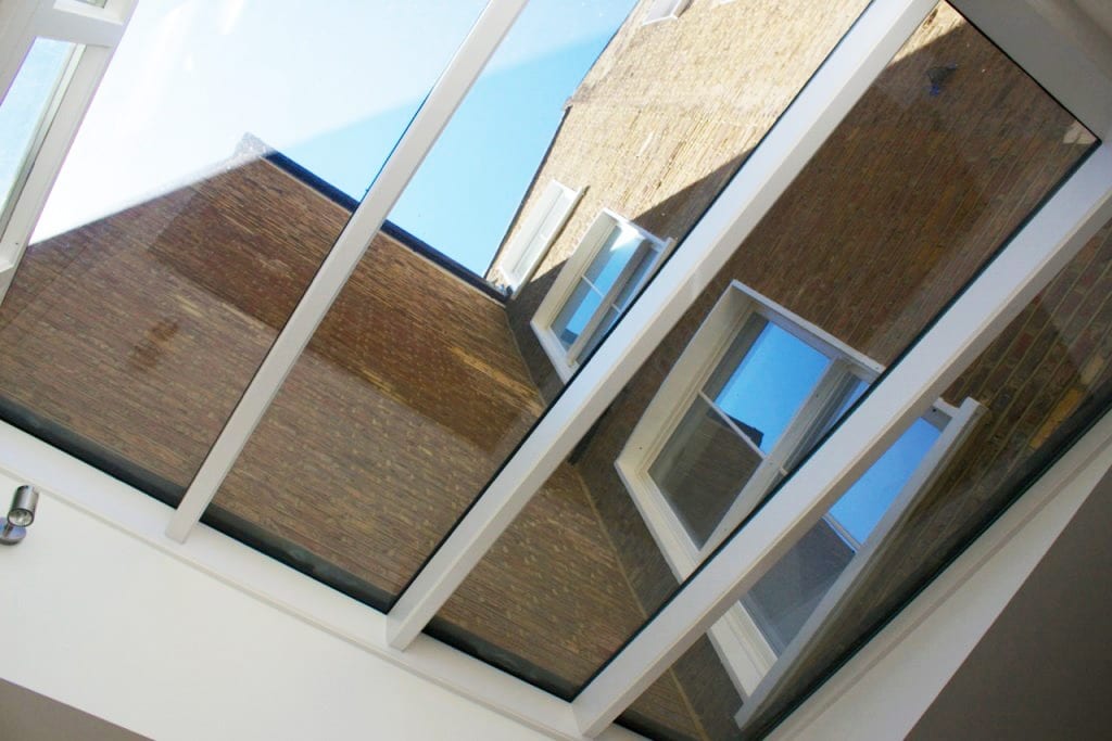Unusual view of a wooden roof lantern showing wooden sliding sash windows in the floors above