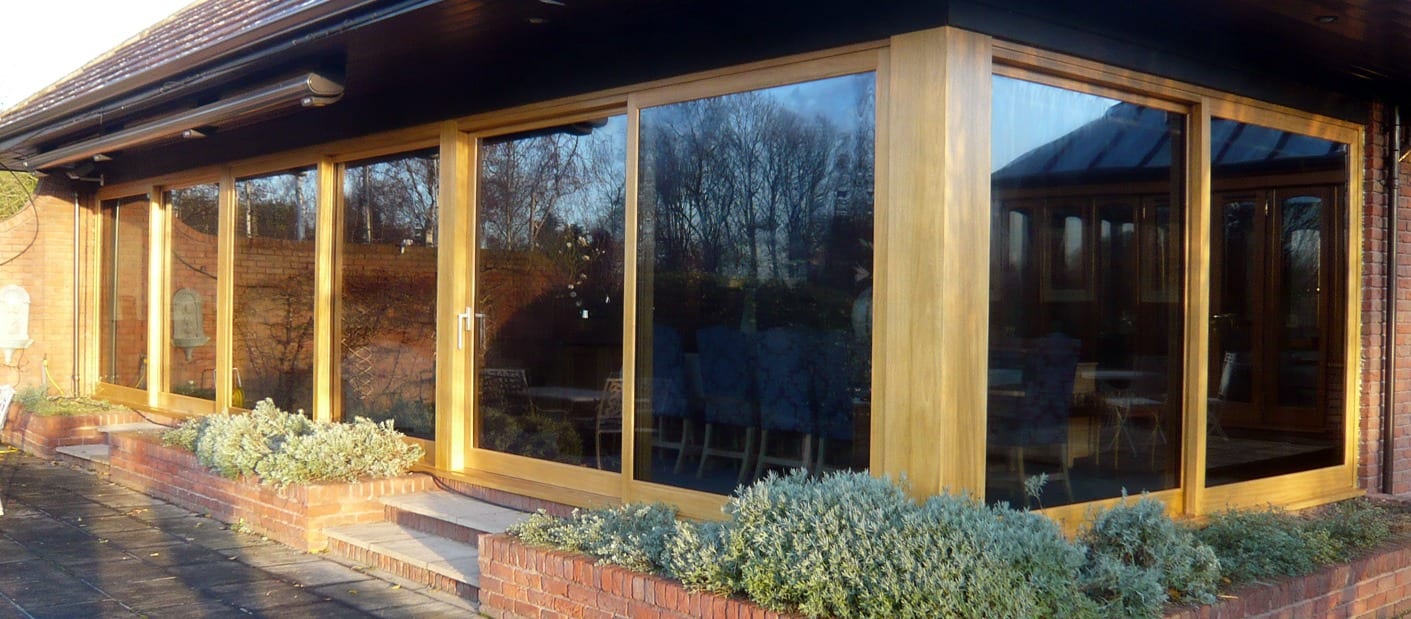 Lift and slide wooden patio doors fitted to a house