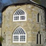 gallery gothic style church building with arched wooden heritage windows