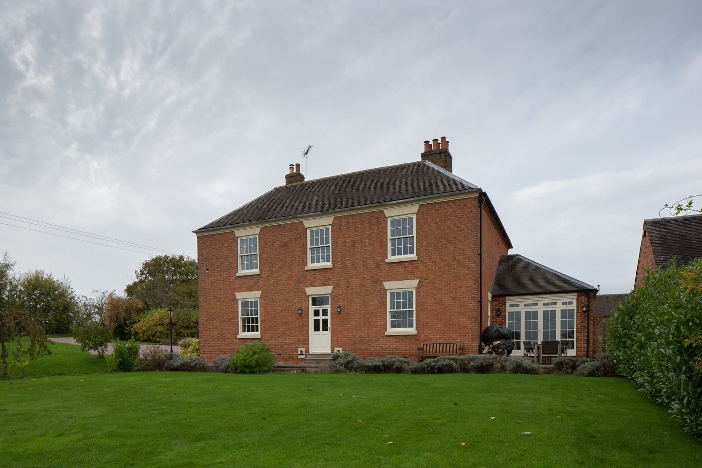 Chatsworth sliding sash Georgian bars astragals painted white elevation brick house