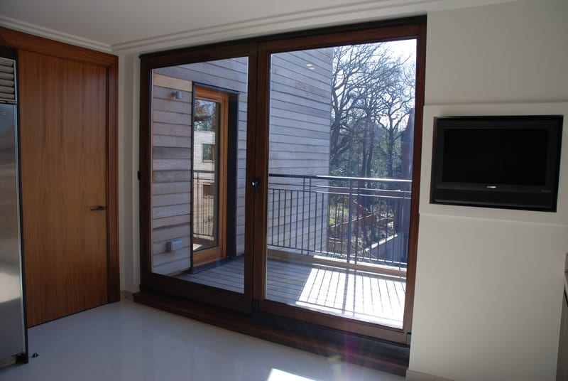 Hardwood tilt and slide door dark stained idigbo 2