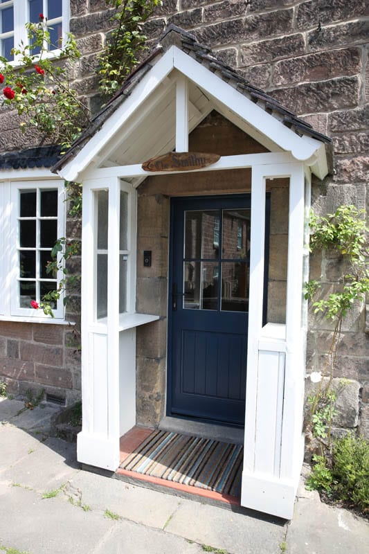 The porch and heritage door at the front of the Smithy