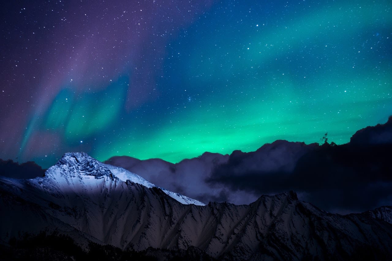 landscape photo of mountain with polar lights to represent eco sliding sash windows