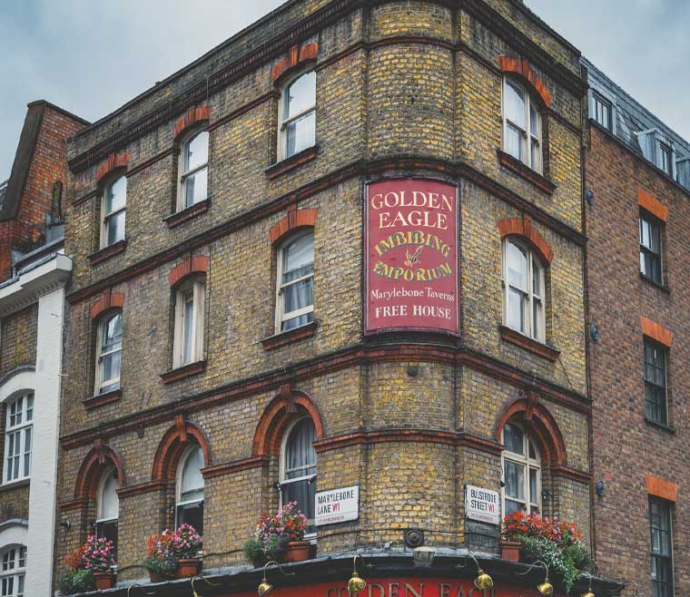 The History of Sashed Windows: A Beginner's Guide - a shot of a traditional pub with heritage sash windows