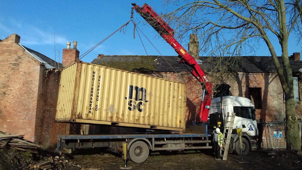 Canal Side Cottages: a container of equipment arrives during the resoration