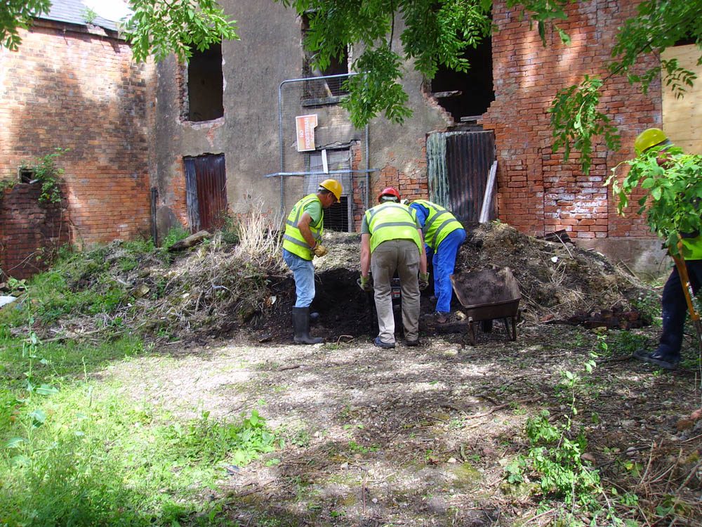 Canal Side Cottages: volunteers at work at the rear of the cottages