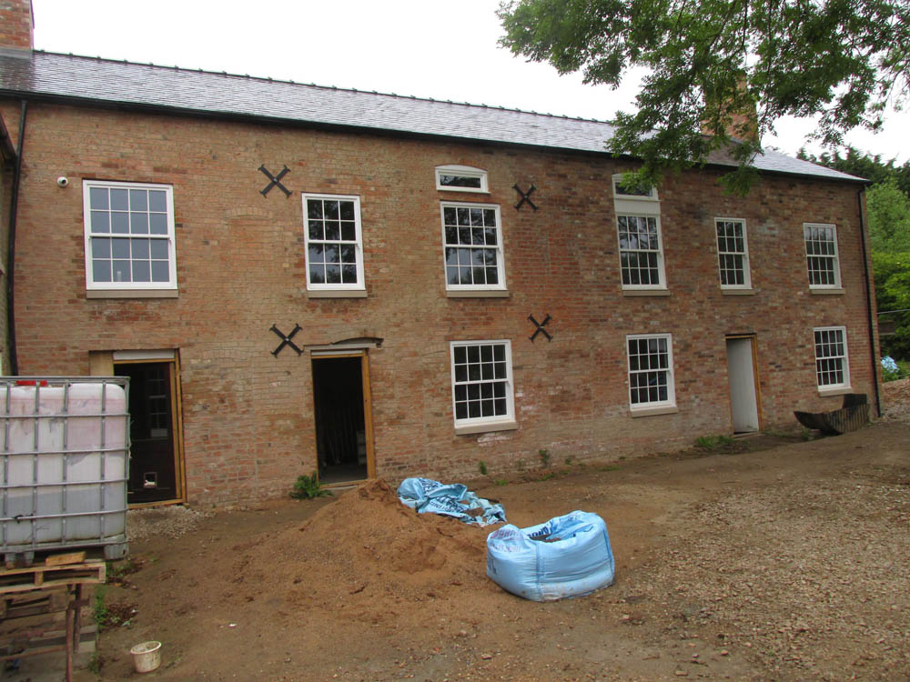 Canal Side Cottages: the restoration progress with windows installed