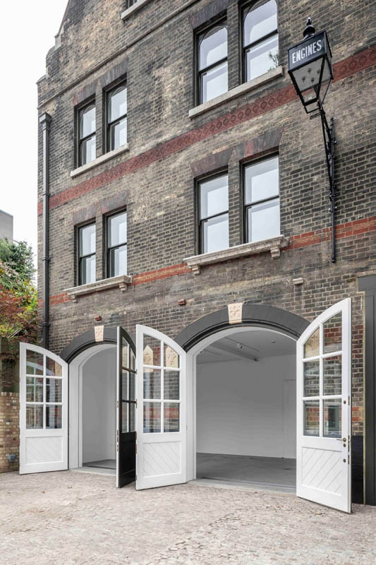 South London Gallery Fire Station: long shot of heritage doors from the outside with the doors open to show the white interior